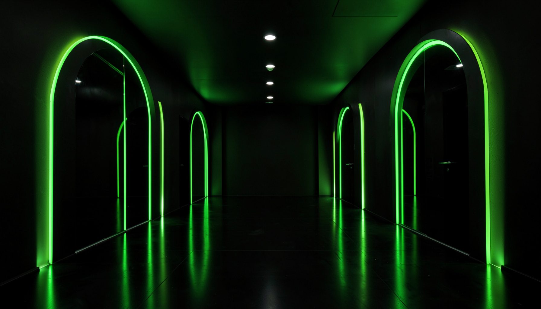 Symmetrical dark arcade-style lobby with mirrored neon green archways, polished black floors, and lime accent lighting.